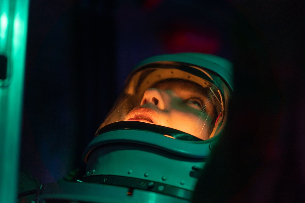 a cartoon astronaut looking confused at a proprietary oxygen tank with a giant price tag