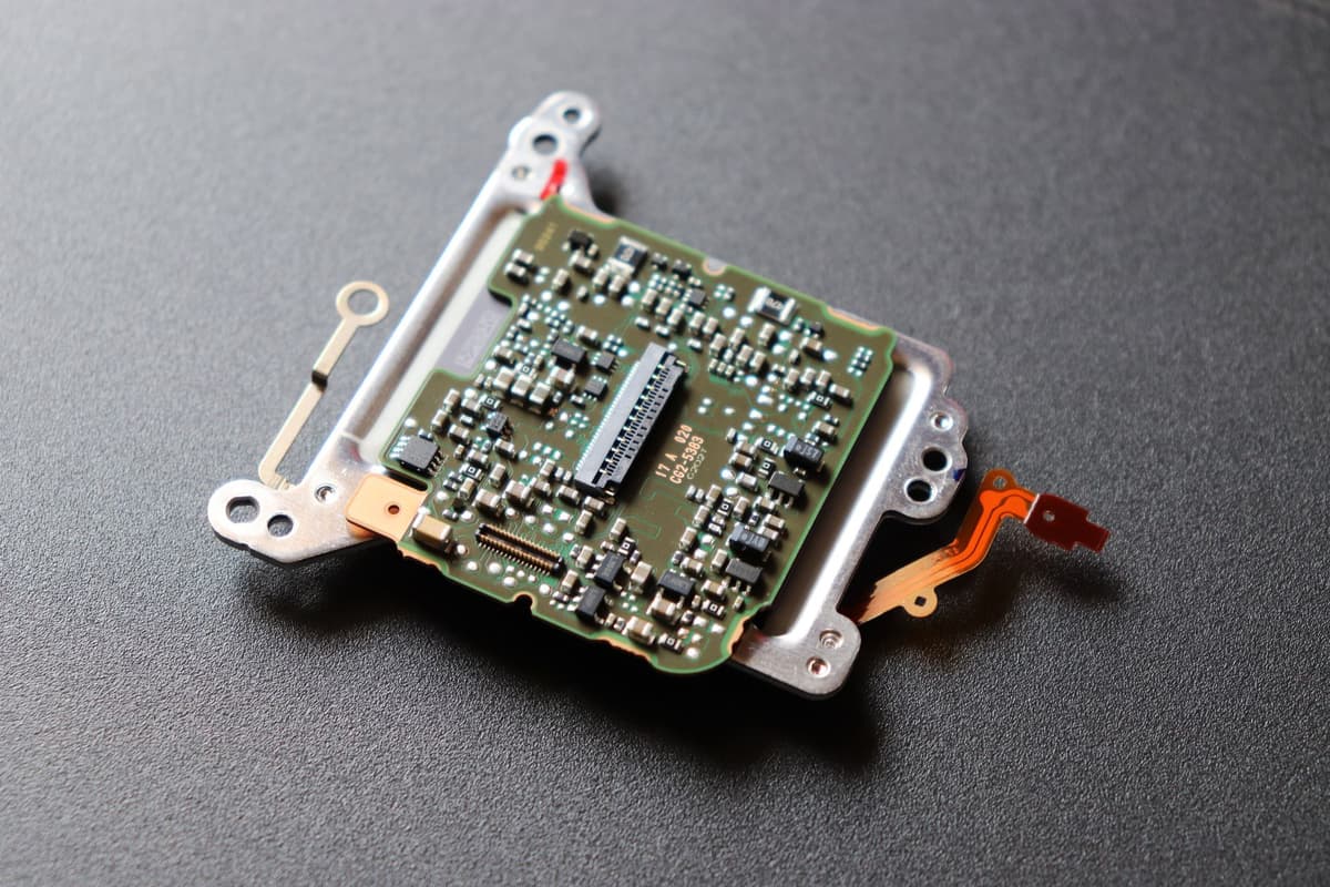 a high-resolution circuit board connected to an old ribbon cable