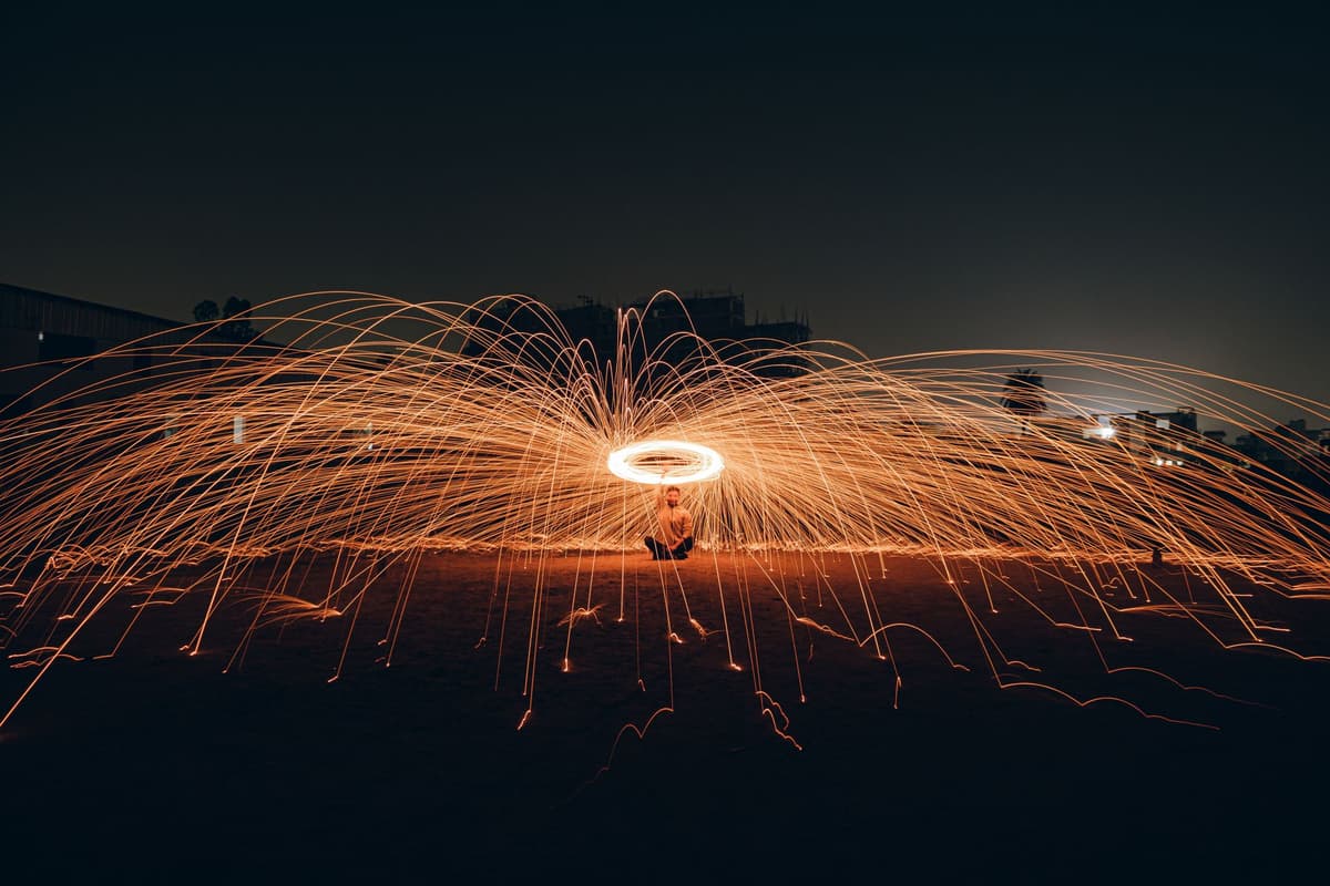 a single bright spark hitting a dark pool of water