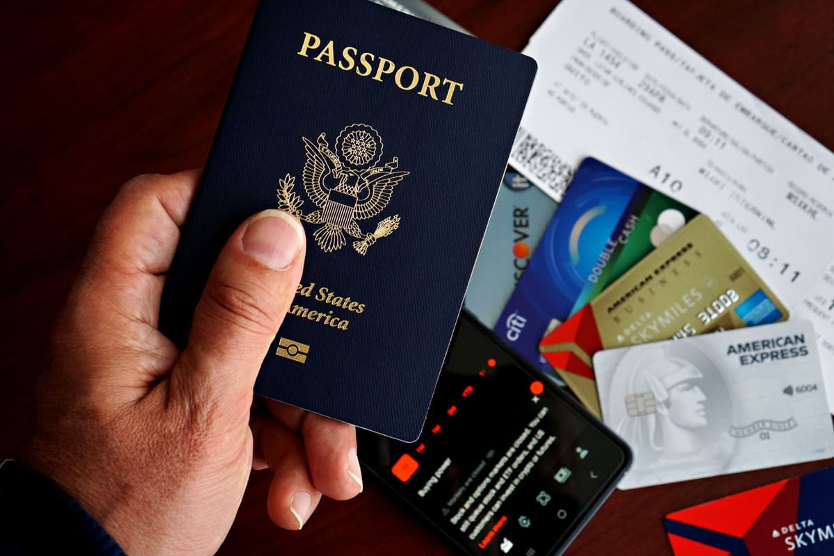 a confused soccer player holding a passport at a TSA checkpoint