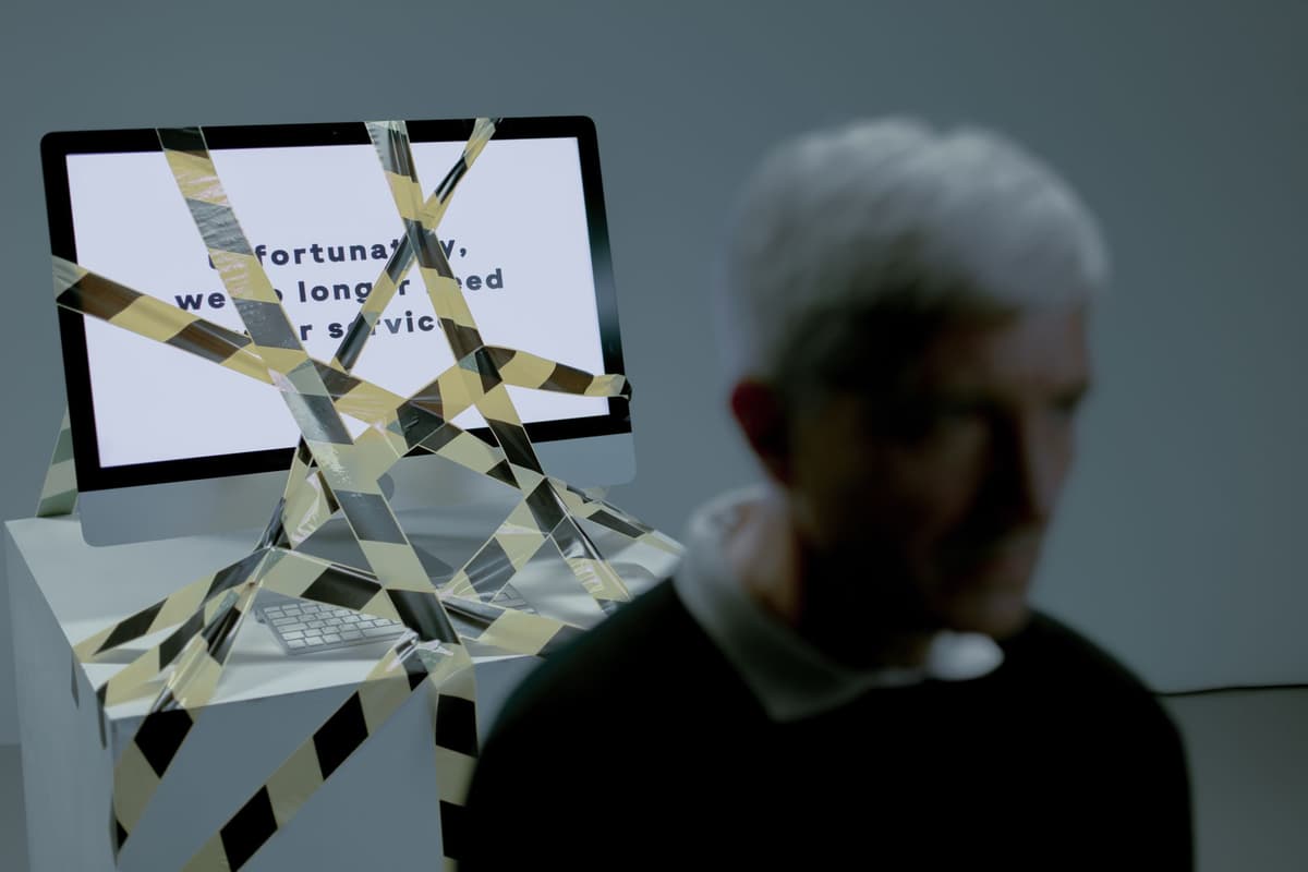 a beret-wearing computer rejecting a spreadsheet