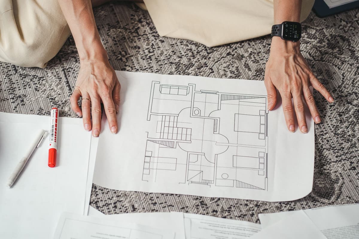 a hand-drawn blueprint of a house on a crumpled napkin