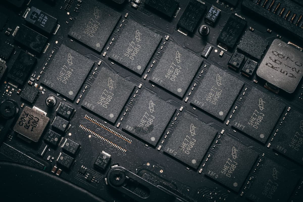 a single coffee mug sitting on a massive pile of scattered circuit boards