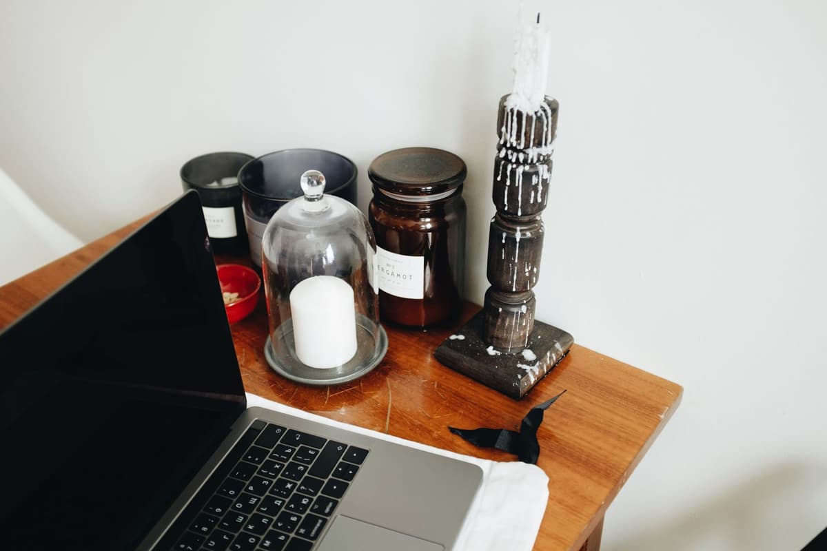 an old wooden desk with a single laptop