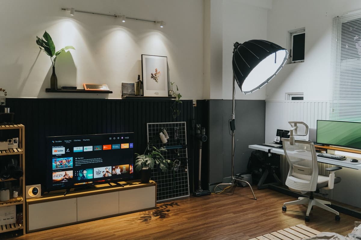 a single glowing television screen in a dark, empty room