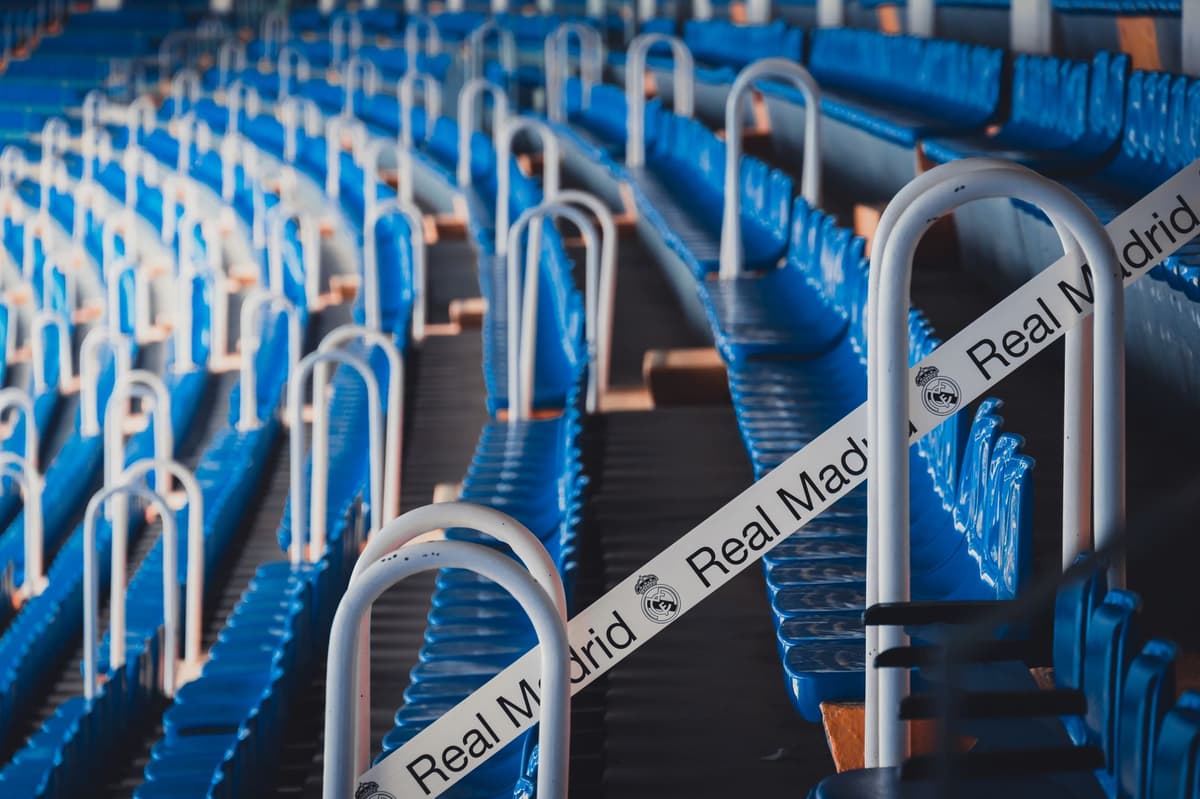 a construction crew removing luxury leather stadium seats with a crowbar