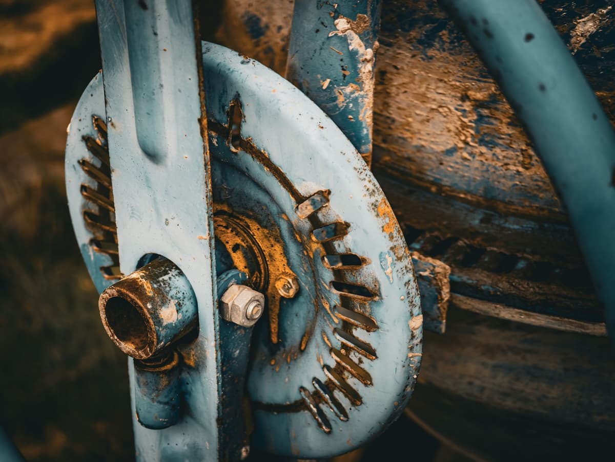 a man pull-starting a heavy mechanical device in a cafe