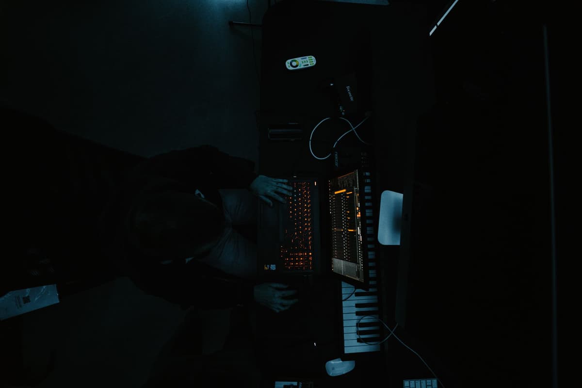 a single glowing computer monitor in a dark room