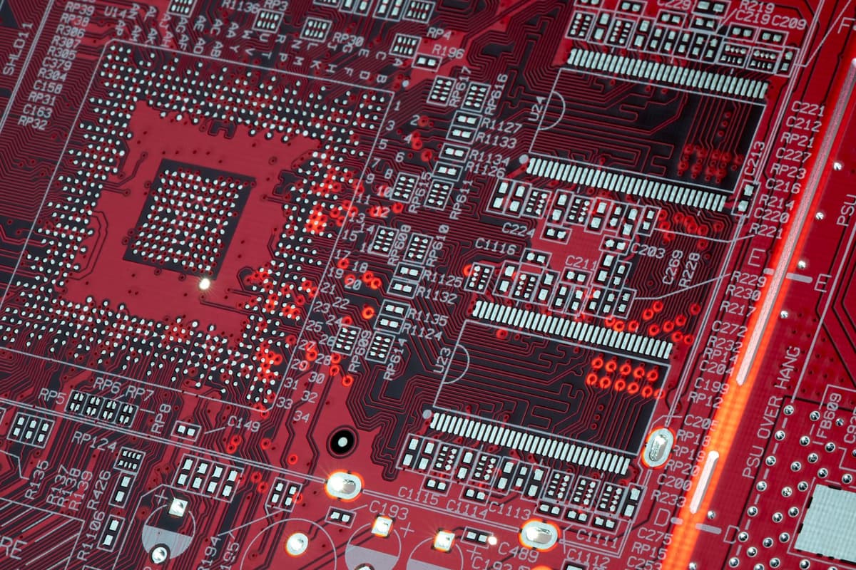 a single glowing neuron connecting to a circuit board