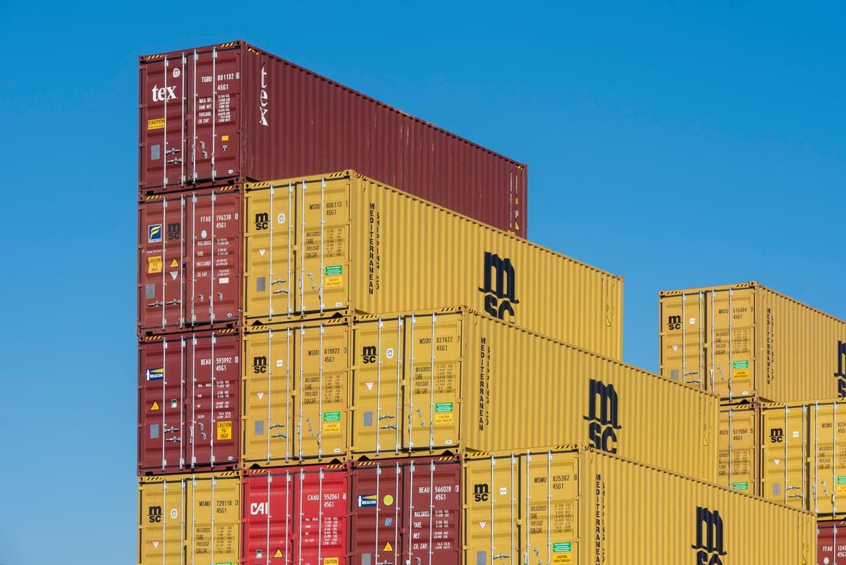 stacks of colorful shipping containers arranged like stadium seating