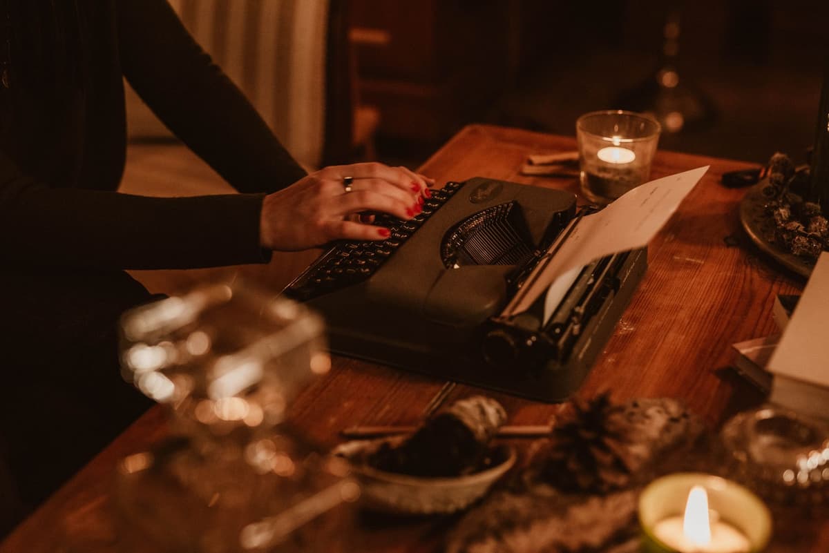 a dusty parchment manuscript lying next to a glowing laptop