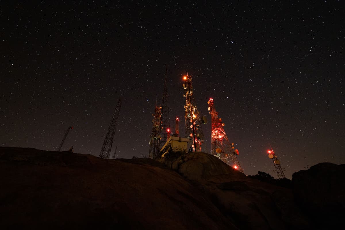 a satellite dish with stars in the background, looking slightly askew