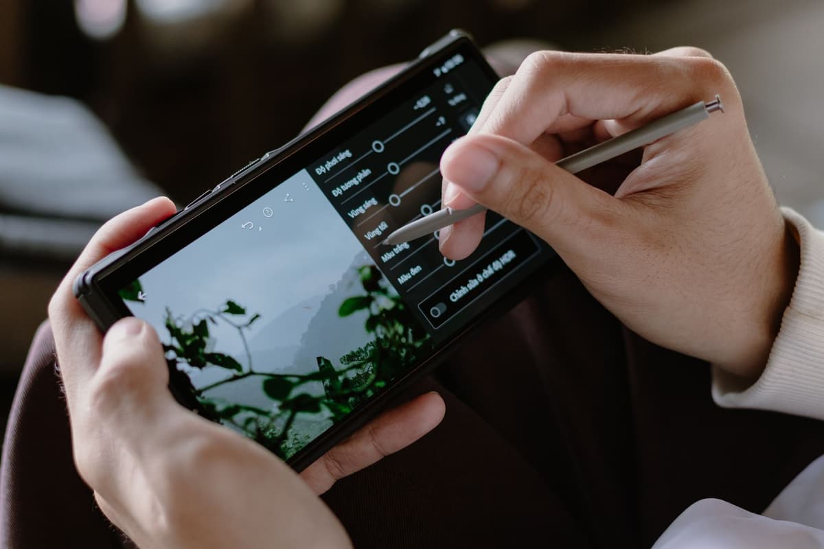 a person scanning a crumpled taco wrapper with a sleek silver pen device