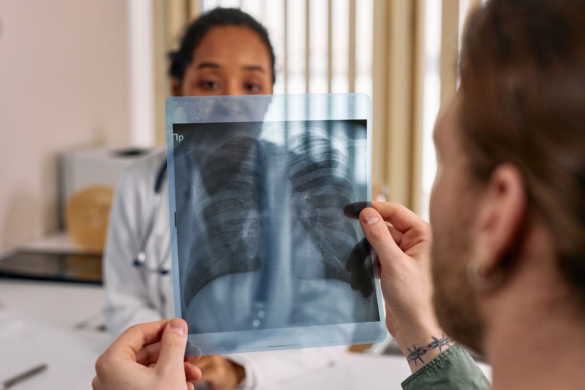 doctor examining an illuminated medical scan