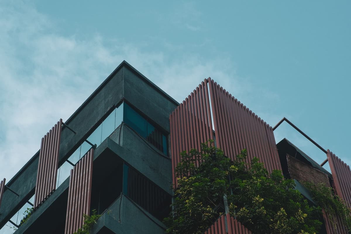 a modern building facade covered in vertical greenery