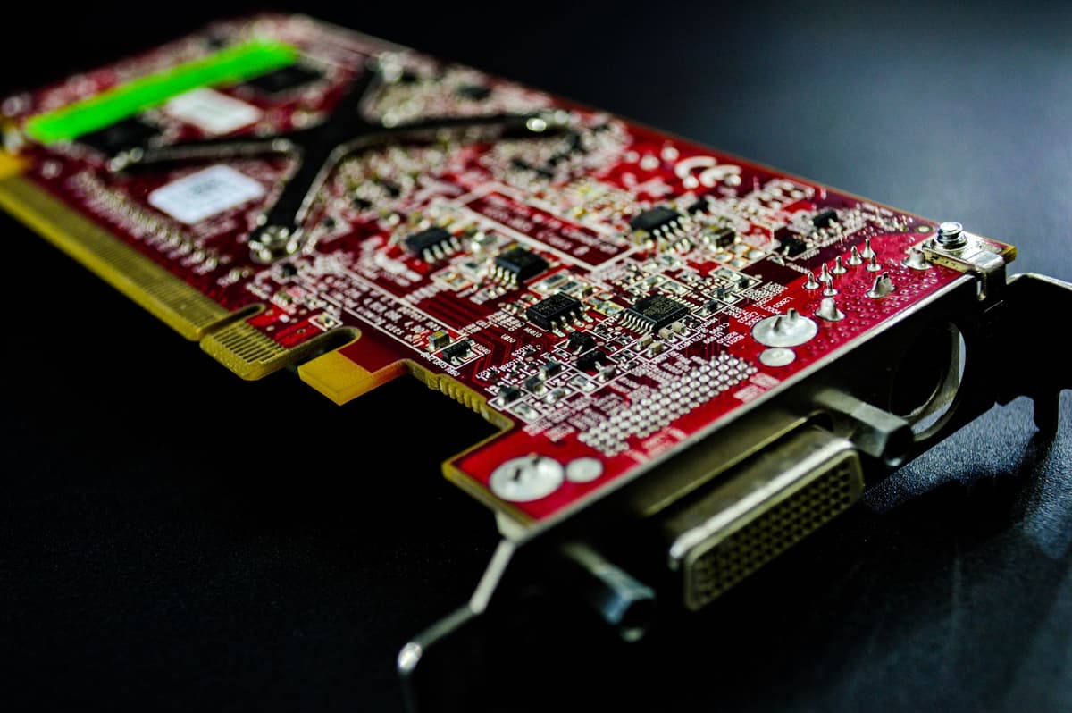 a high-end graphics card resting on top of a printed topographic map