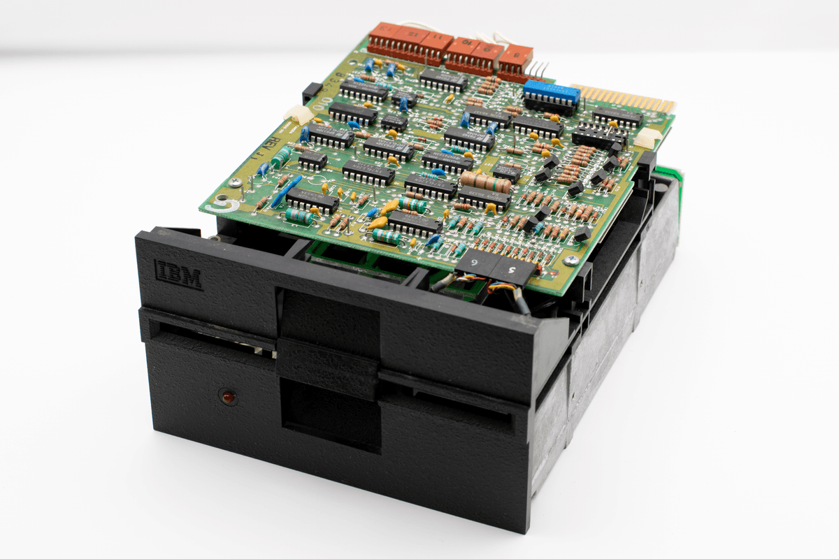 a single glowing microchip sitting on a massive empty pedestal