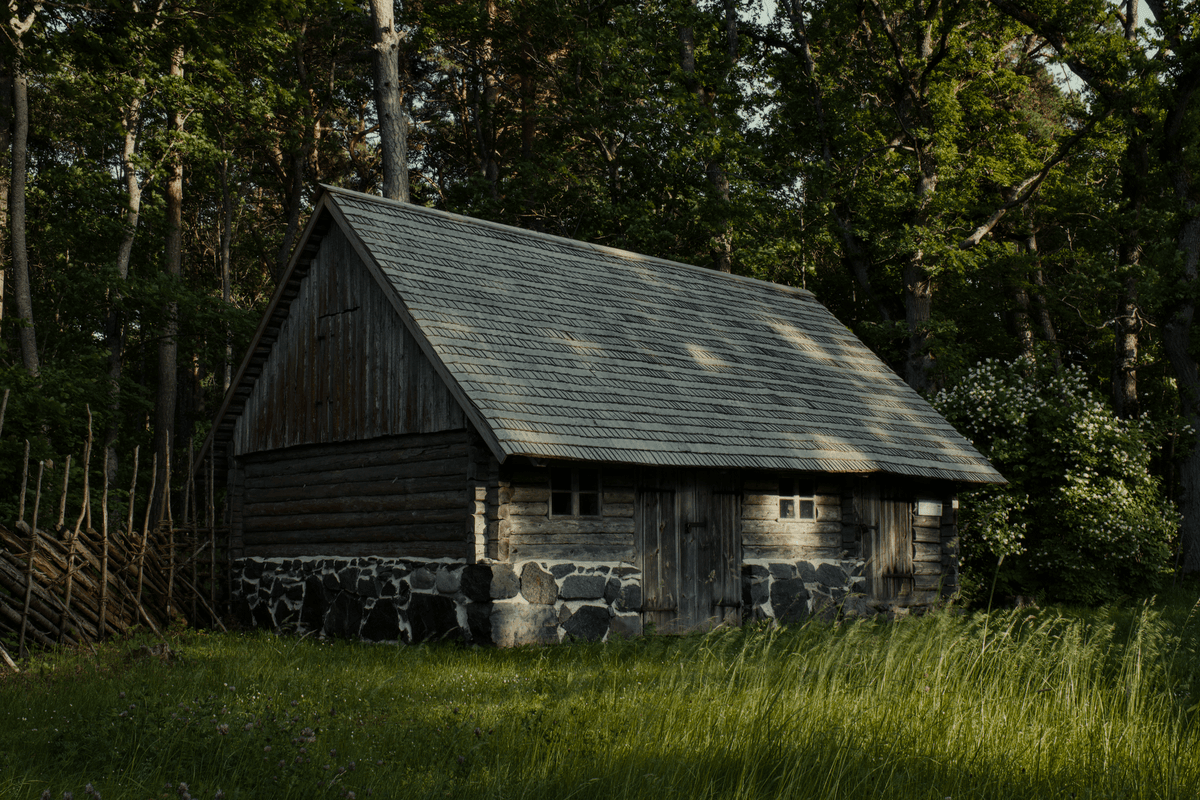 a rustic stone cottage with a glowing fiber optic cable