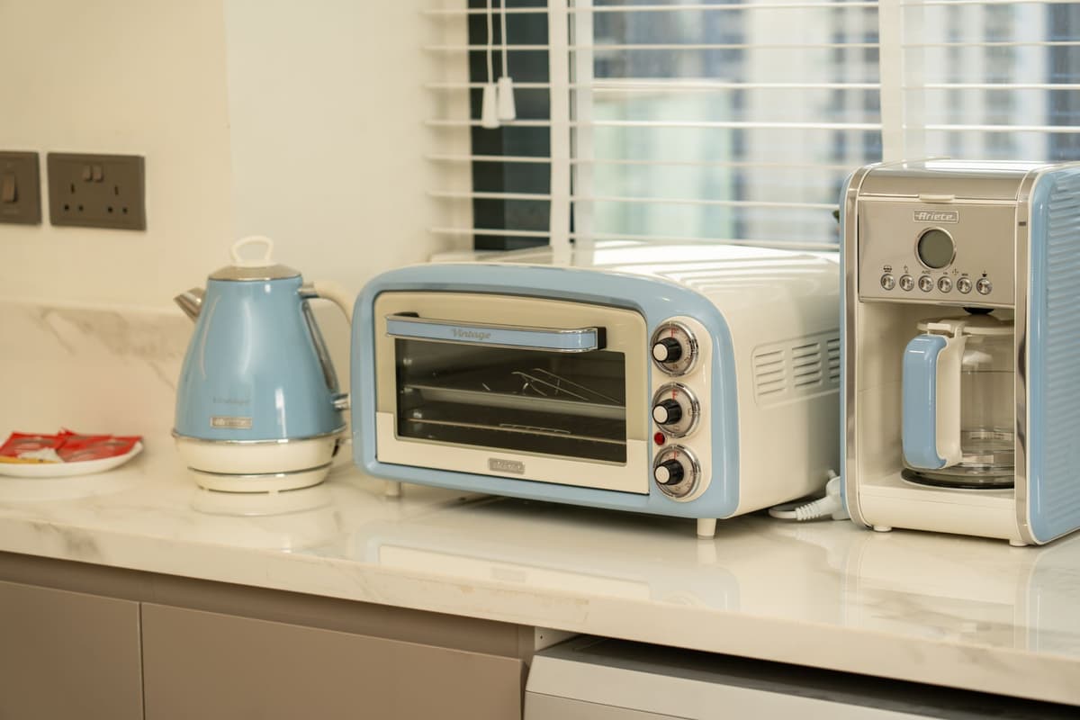 a smart toaster with a tiny holographic brain hovering above it