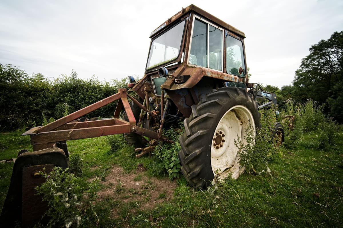 a dusty tractor cabin with a finger-smudged screen