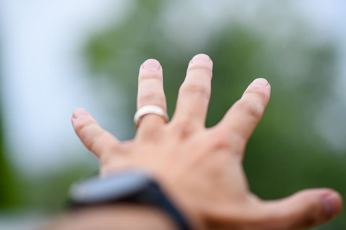 a surgical-grade microchip resting on a fingertip