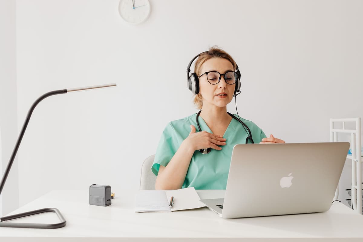 a high-tech medical headset resting on a mahogany desk