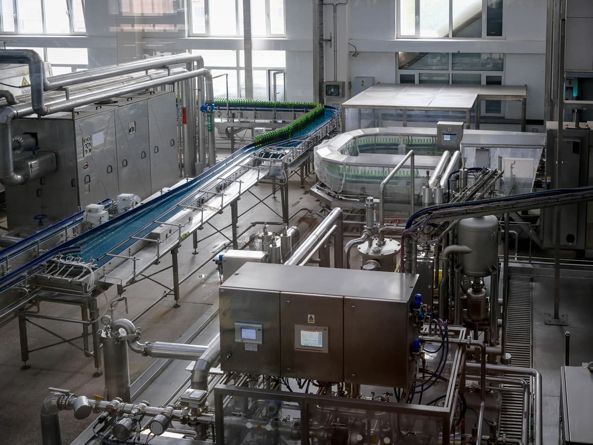 massive stainless steel cryostat in a cleanroom