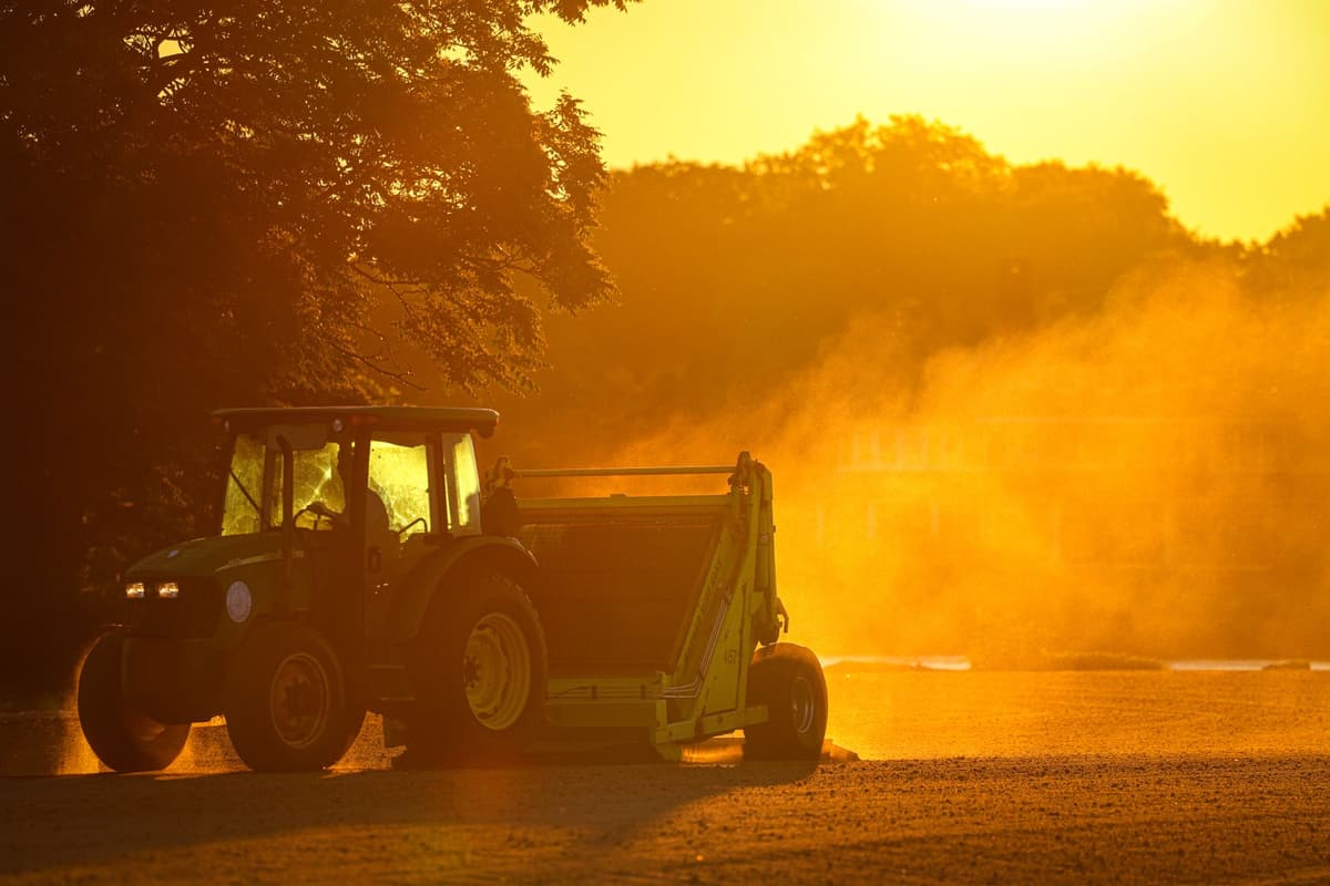 corporate laptop open in a dusty tractor cab