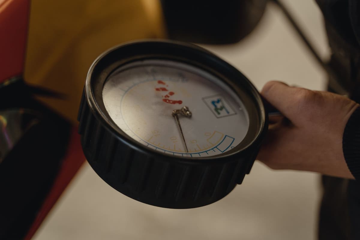 a high-tech water filtration gauge on a marble wall