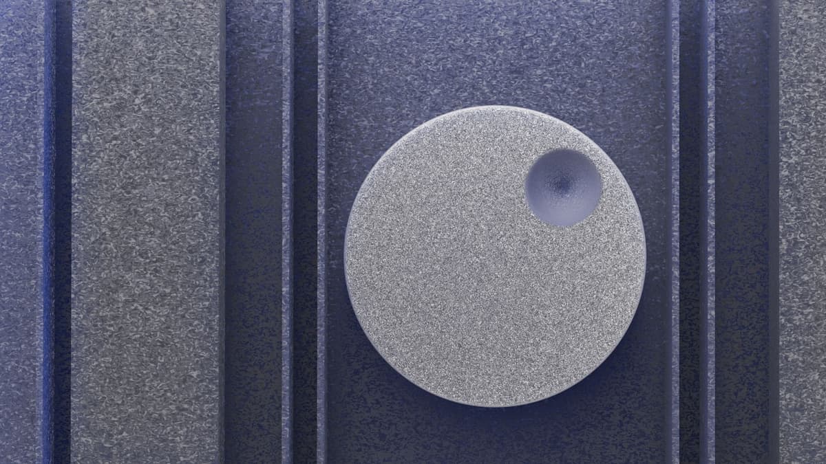 a single silver disc sitting on grey lunar dust
