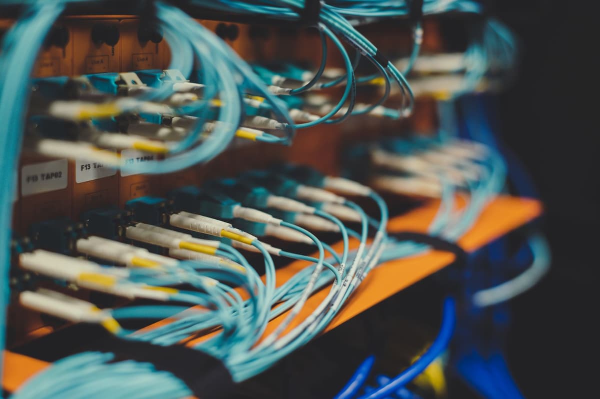 server room rack with tangled optical cables