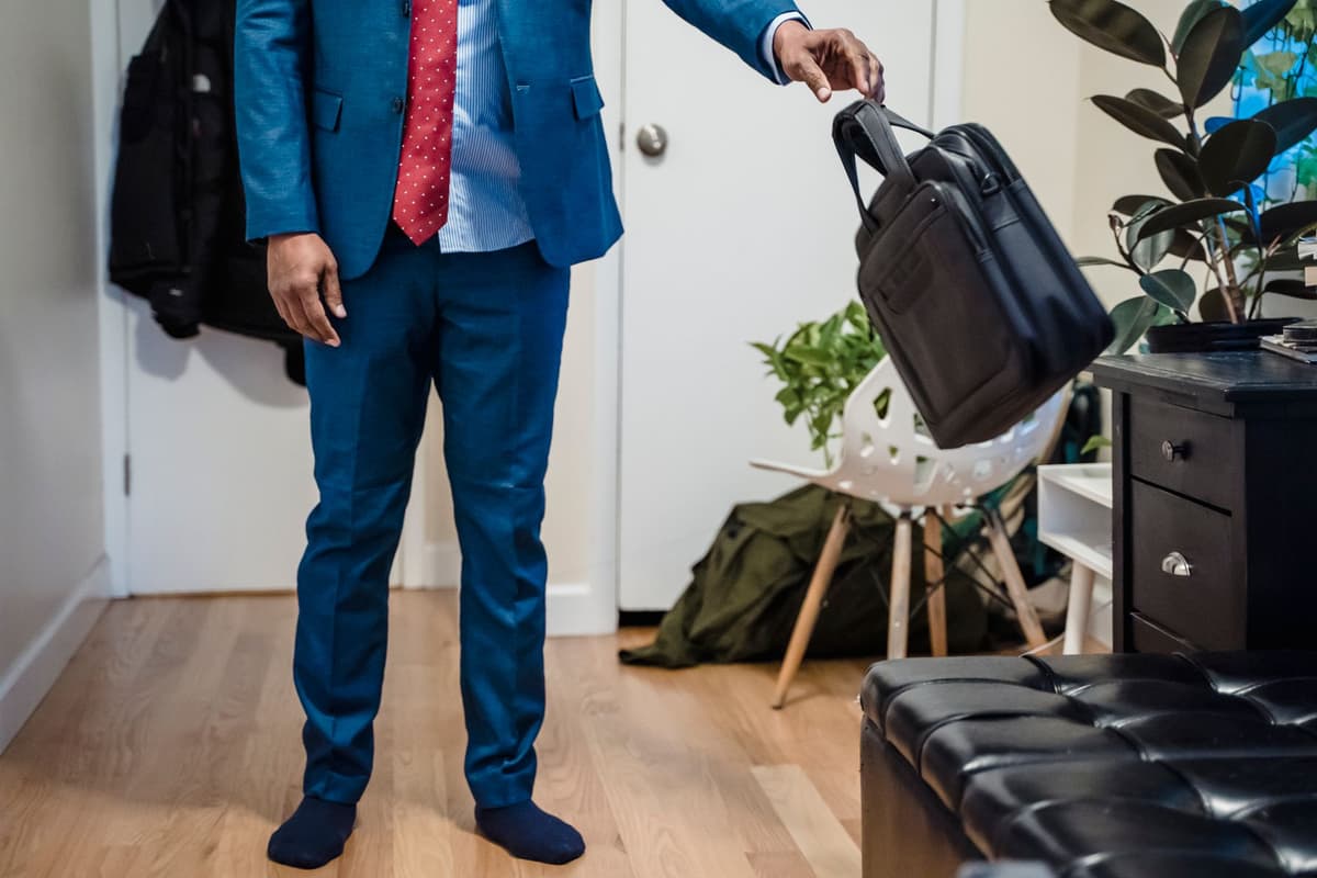 a futuristic toaster wearing a tiny business suit and tie