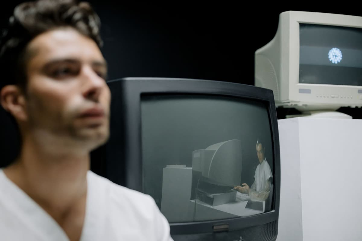 a single lit computer monitor in a dark studio