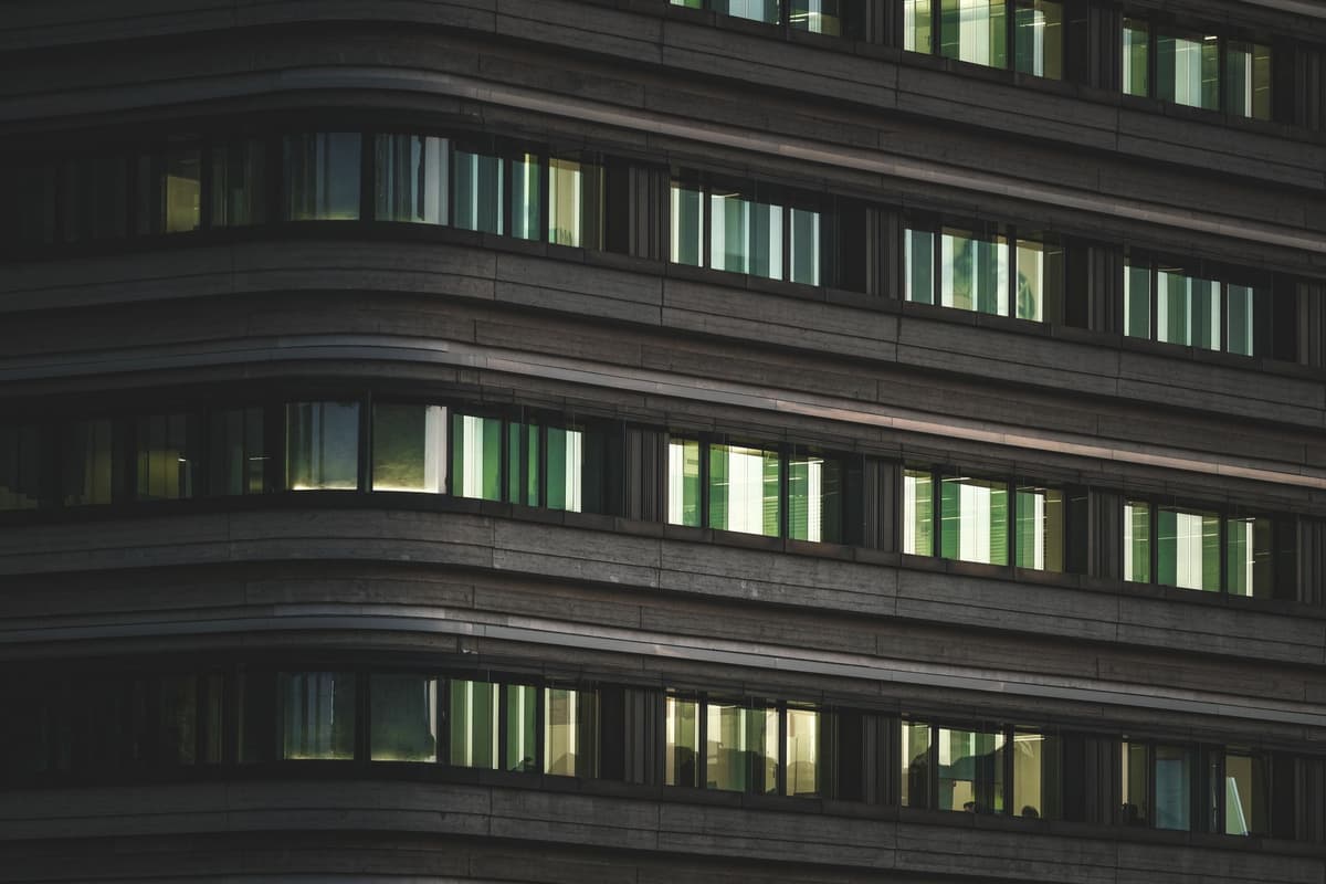 glowing windows of office building at night
