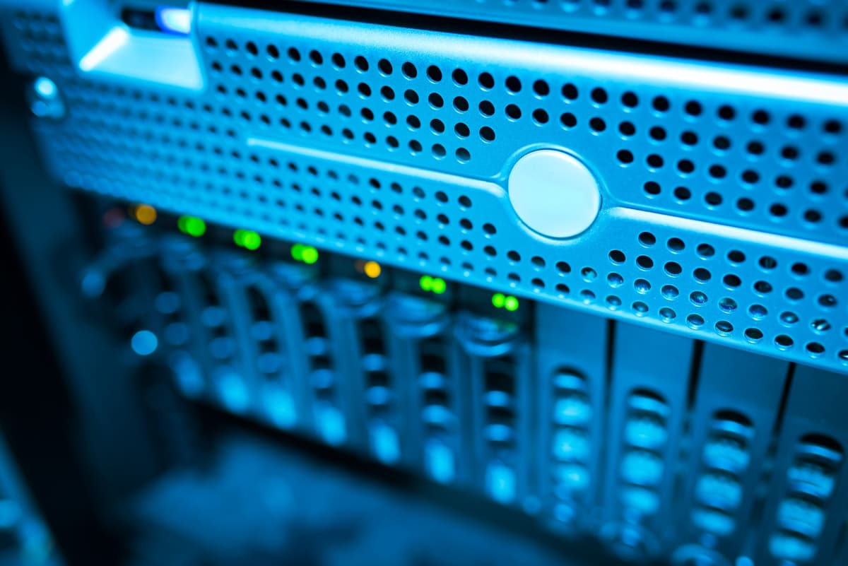 a high-tech server rack glowing in a dark observatory