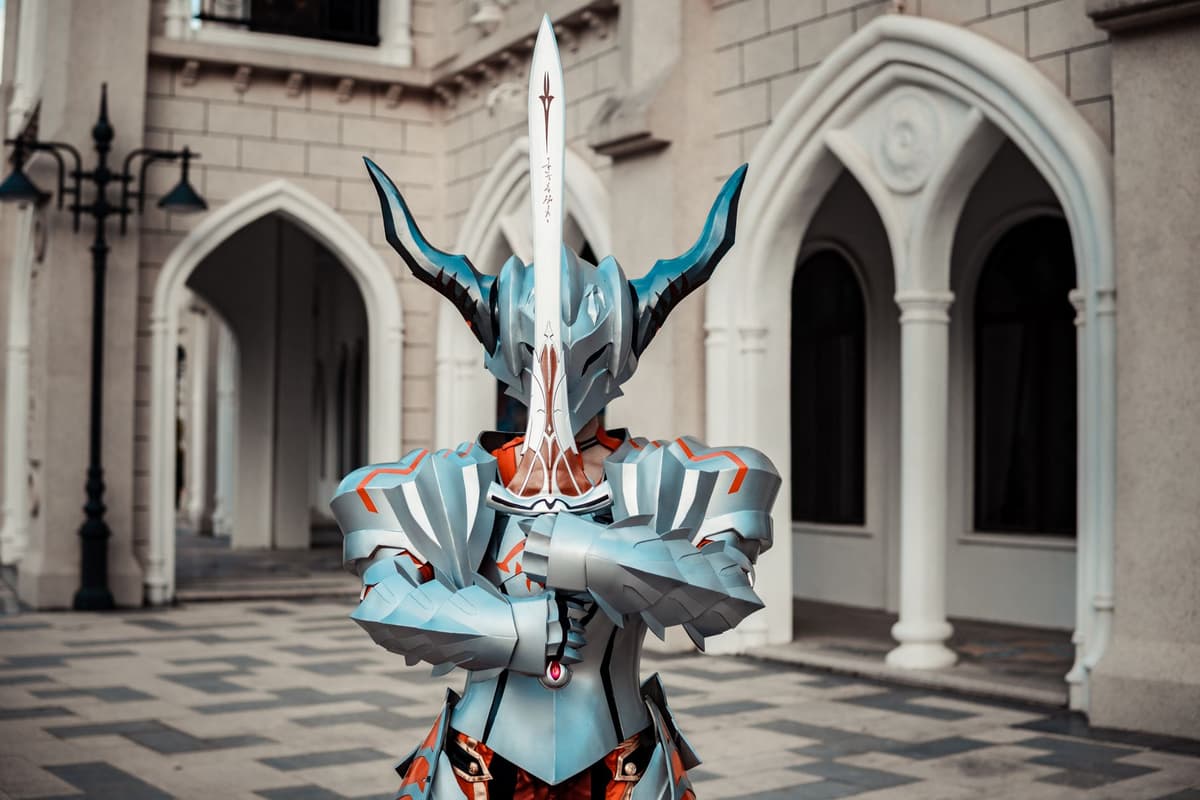a knight in full plate armor holding a tiny allen wrench