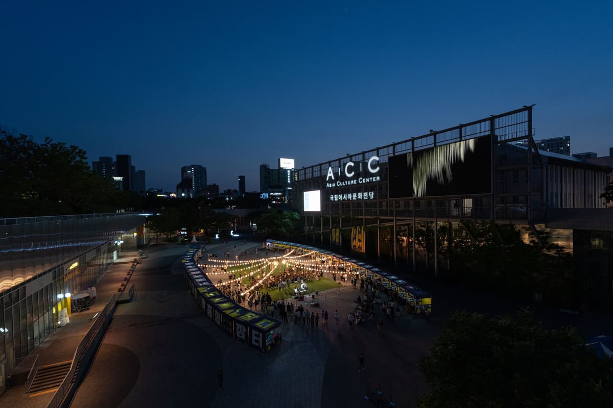 aerial view of two glowing square voids at night