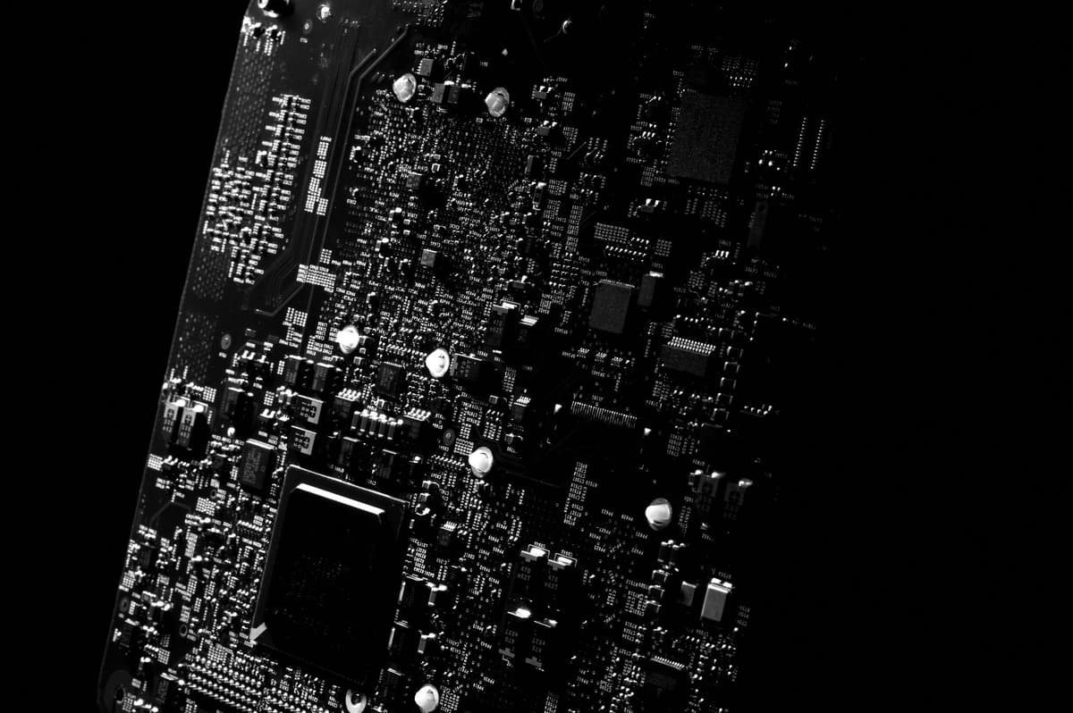 a high resolution macro photograph of a delidded microchip showing complex circuitry