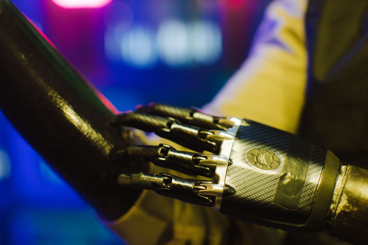 a metal robot foot gripping a jagged rock