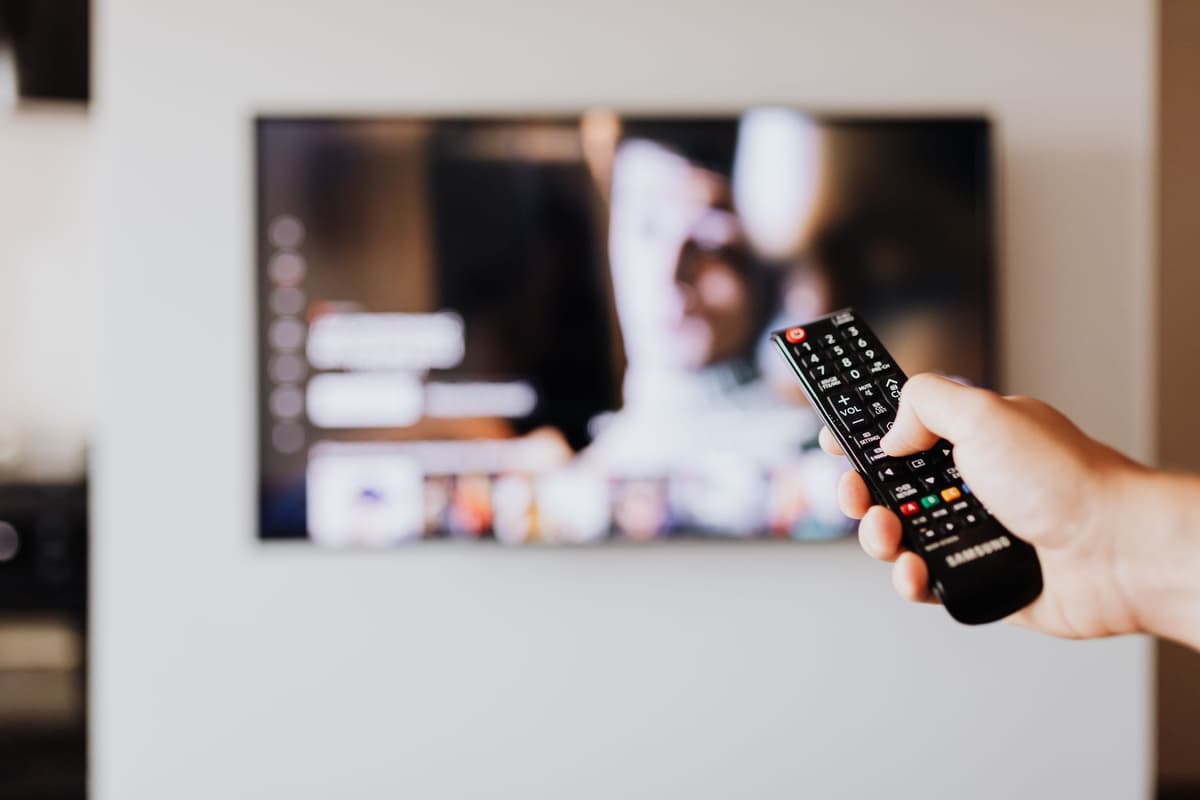 glowing smart tv in dark empty living room