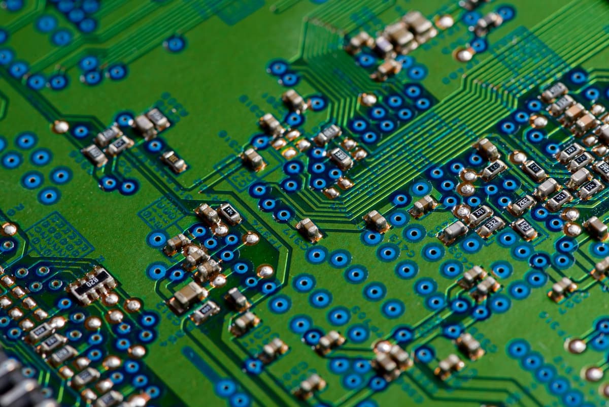 glowing green computer circuit board close up
