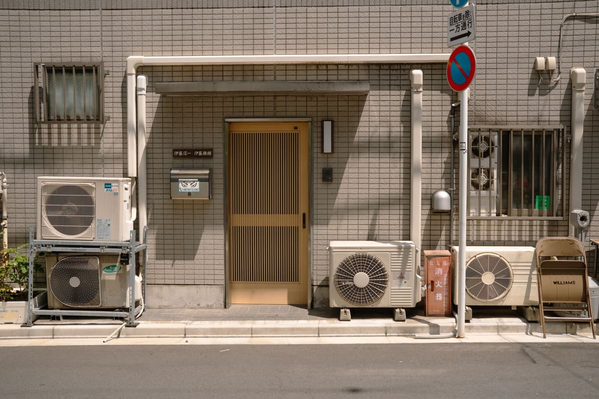 an open air conditioner unit showing wires