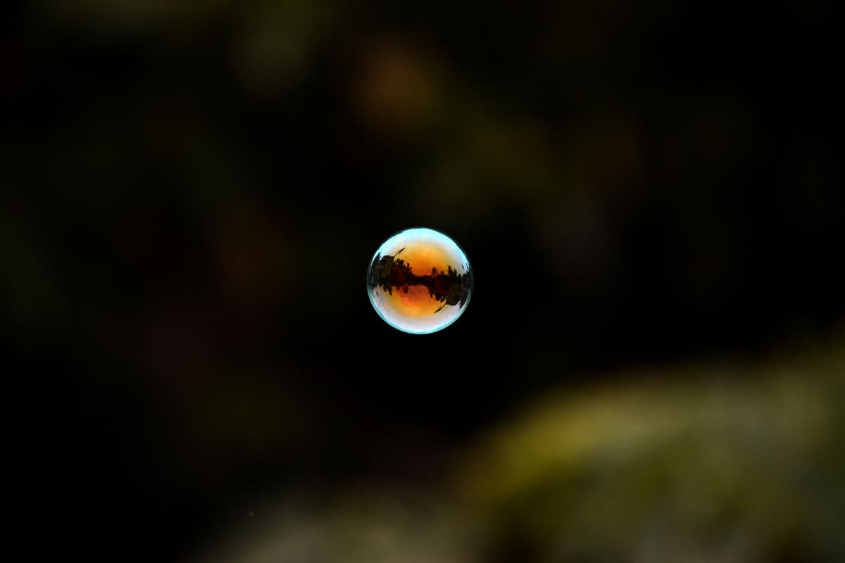 a glowing orange sphere with dark internal ripples
