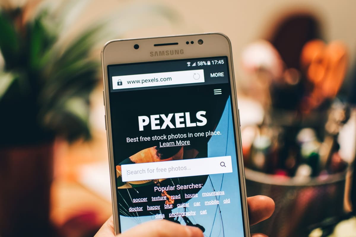 close up of smartphone displaying chaotic web advertisements