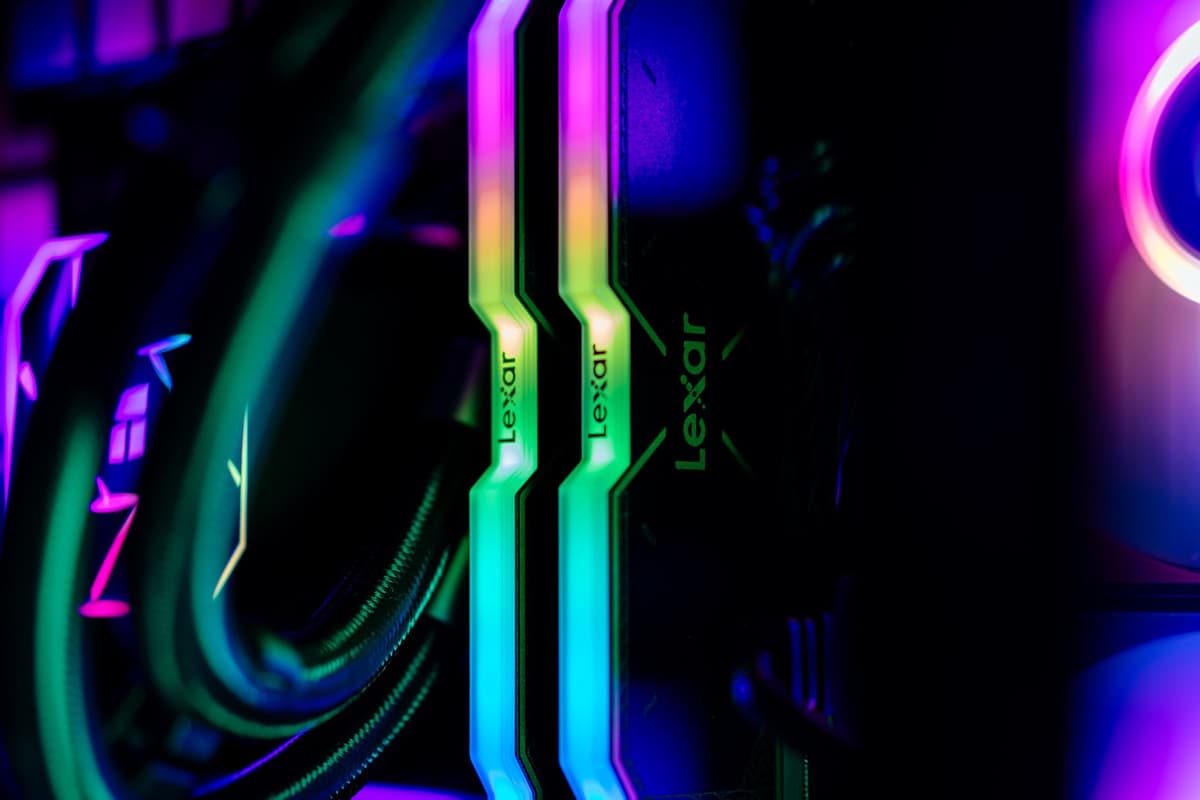 a massive black computer tower glowing with green internal lights