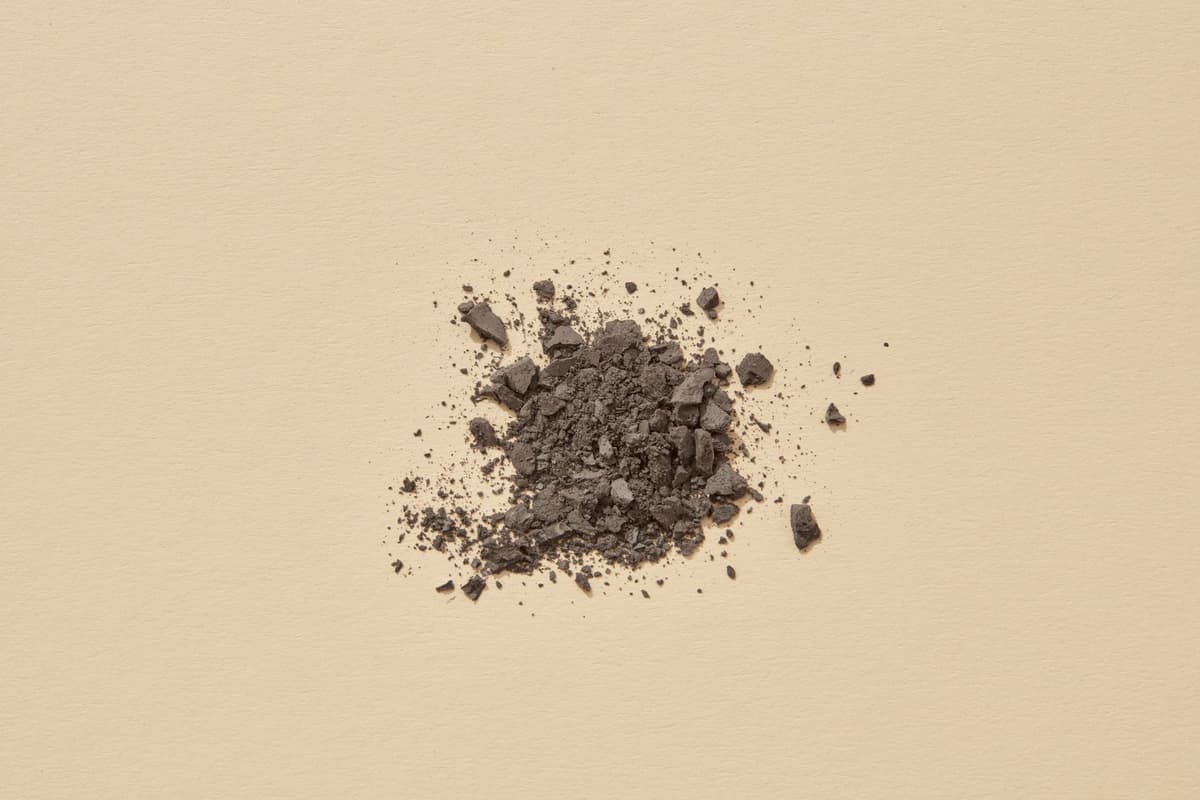 close up of textured ochre pigment powder