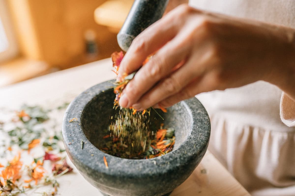 blue minerals in a stone mortar and pestle