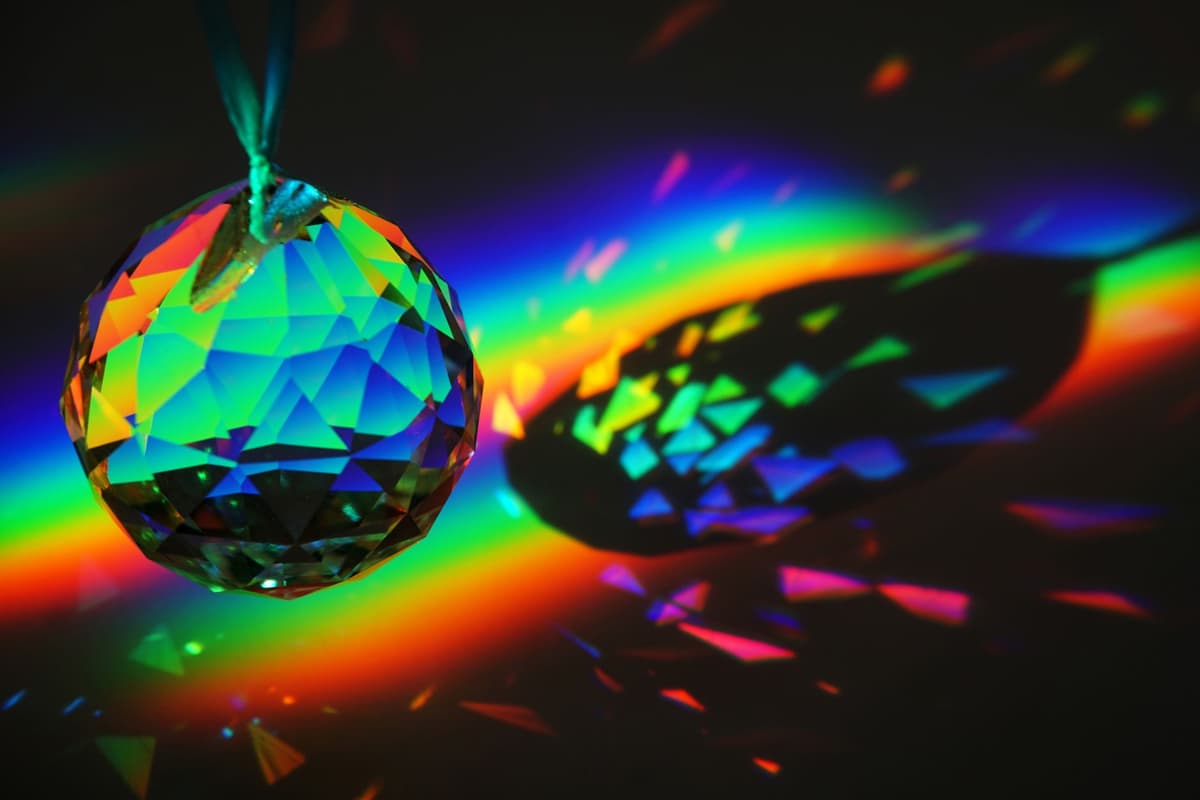 a single glass prism splitting white light into a rainbow