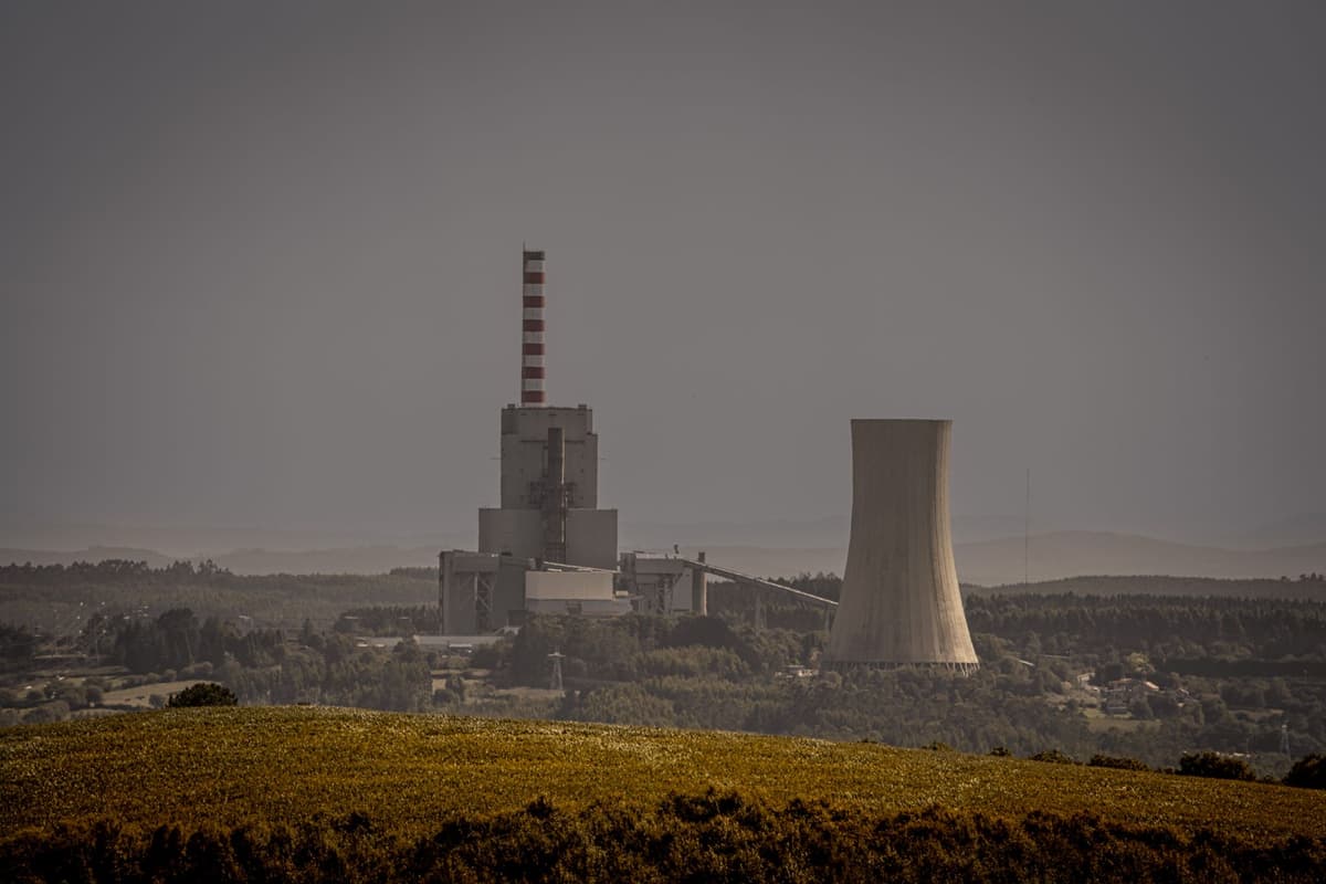 massive industrial cooling towers on a concrete roof