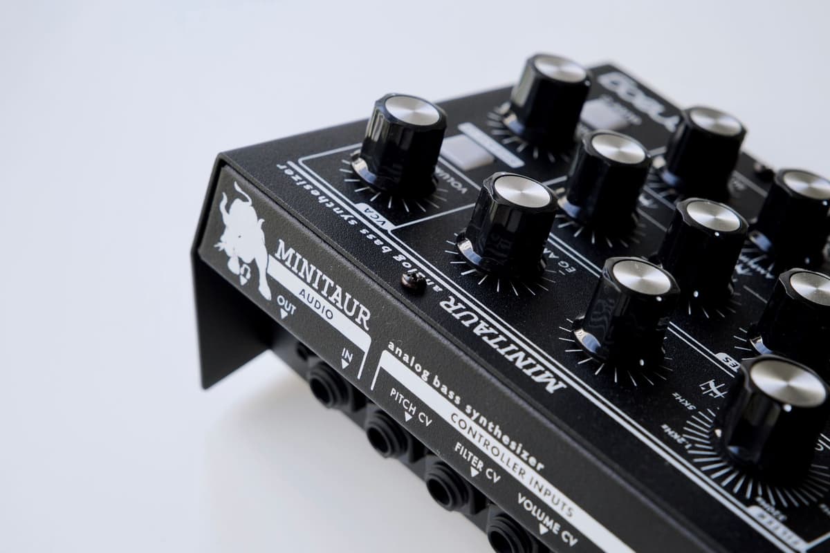 modular synthesizer covered in tangled colorful patch cables